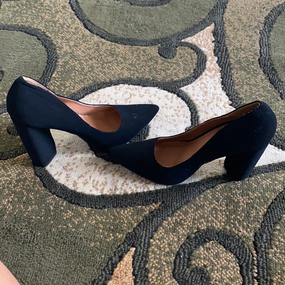 Never worn Black high heel shoe. Size 8